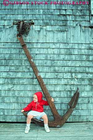Stock Photo #9263: keywords -  anchor anchors antique big child children coast coastal contract contrasting difference different england girl heavy islesford maine new ocean old released scale seashore shore sits size small vert weight
