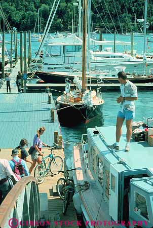 Stock Photo #14281: keywords - bicycle bicycles bicyclist bicyclists bikes boat boats coast coastal england harbor leisure maine new northeast ocean people put recreation region sea shore shoreline sport summer tour touring tours travel vacation vert