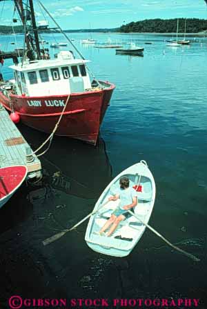 Stock Photo #9270: keywords -  bar boat boats coast coastal dinghy england harbor harbors launch maine man marina marinas maritime new ocean rowing rows sea shore shoreline small town vert