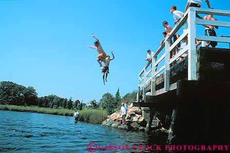 Stock Photo #14311: keywords - boy boys bridge cape centerville coast coastal cod destination england fall falling falls fun gravity group horz jump jumper jumpers jumping jumps leap leaper leapers leaping leaps massachusetts new ocean play playing region resort resorts sea seashore shore shoreline summer sunny sunshine swim swimming travel vacation warm water youth
