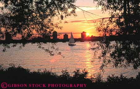 Stock Photo #9740: keywords - boat boats boston charles cities city dark dusk england evening horz massachusetts new orange river rivers sailboat sailboats summer sun sunset sunsets urban water