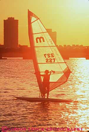Stock Photo #9750: keywords - activities activity alone boat boats boston charles cities city england evening exercise exercising fitness float floating floats fun glide glides gliding massachusetts material new orange people play recreation river sail sailboard sailboarder sailboarding sailboat sailboats sailer sailing sails sands silhouette silhouettes solitary solitude sport sports stand standing summer sunny sunset sunsets synthetic urban vert warm water wind windsurf windsurfer windsurfers windsurfing yellow