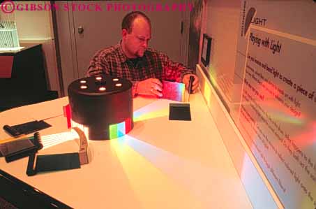 Stock Photo #9778: keywords - activities activity boston cities city color display displays does england exhibit exhibits experiment experiments hands horz interactive interior learn learning light lighting lights man massachusetts museum museums new of public recreation science spectrum urban