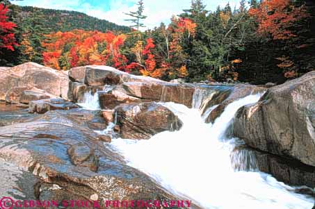 Stock Photo #9302: keywords - autumn blur blurred color colorful countryside england fall falls flow flowing foliage forest hampshire highway horz kancamagus landscape lower maple move movement moving near new rapids river rivers rock rocks rural scenery scenic season stream swift tree trees water waterfall waterfalls