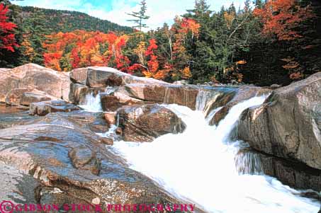 Stock Photo #9302: keywords -  autumn blur blurred color colorful countryside england fall falls flow flowing foliage forest hampshire highway horz kancamagus landscape lower maple move movement moving near new rapids river rivers rock rocks rural scenery scenic season stream swift tree trees water waterfall waterfalls