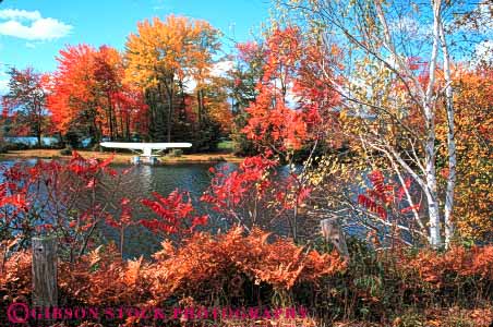 Stock Photo #9303: keywords -  andover autumn color colorful countryside england fall foliage forest hampshire highland horz lake lakes landscape maple new parked plane rural scenery scenic seaplane season tree trees water