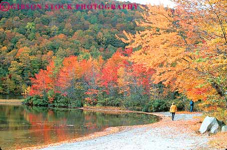Stock Photo #14445: keywords -  autumn color couple couples england fall foliage hampshire hike hiker hikers hiking horz man mountains new pair people pond region season shoreline two walker walking walks white woman
