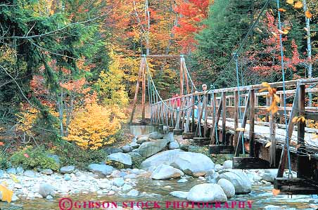 Stock Photo #14457: keywords - along autumn bridge bridges color england fall foliage foot footbridge hampshire highway hike hiker hikers hiking horz hwy kancamagus landscape lincoln mountains natural nature new over people region river rivers route routes scenery scenic season white