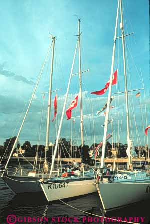 Stock Photo #9288: keywords -  bay boat boating boats coast coastal cove destination dock docks england harbor harbors island marina marinas new newport ocean port recreation rhode sailboat sailboats sea seashore ship ships shore shoreline travel vacation vert water wharf wharfs