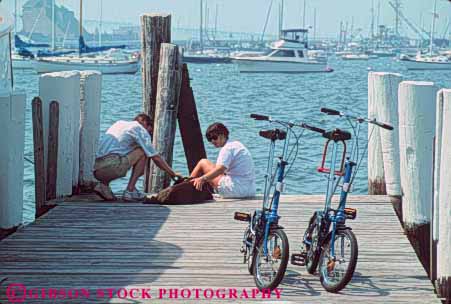 Stock Photo #9293: keywords - bay bicycles bicycling bicyclists bike bikes boat boating boats coast coastal collaspable compact couple cove destination dock docks dog dogs england foldable harbor harbors horz island man marina marinas new newport ocean pet pets port recreation rhode sea seashore ship ships shore shoreline travel two vacation water wharf wharfs woman