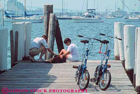 Stock Photo #9293: keywords -  bay bicycles bicycling bicyclists bike bikes boat boating boats coast coastal collaspable compact couple cove destination dock docks dog dogs england foldable harbor harbors horz island man marina marinas new newport ocean pet pets port recreation rhode sea seashore ship ships shore shoreline travel two vacation water wharf wharfs woman