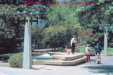 Stock Photo #12335: keywords -  adult adults child children cities downtown familes family horz main mall malls oklahoma parents park parks plaza plazas street summer tulsa