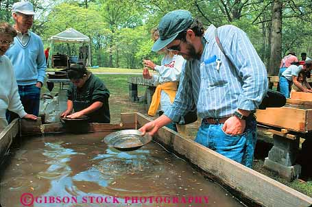 Stock Photo #11600: keywords - [playing activity american amusement annual antebellum atlanta attraction civil costume costumed event fair fairs festival festivals for fun georgia gold history horz living mountain outdoor outside pan panning park parks people play portray portrays recreation reenact reenacting reenactment reenacts south stone tourist war
