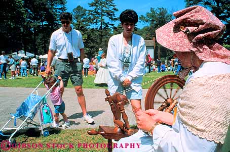 Stock Photo #11601: keywords -  [playing activity american amusement annual antebellum atlanta attraction civil costume costumed demonstrate demonstrates demonstrating display era event fair fairs festival festivals fun georgia history horz living mountain outdoor outside park parks people play portray portrays recreation reenact reenacting reenactment reenacts show south spin spinning spins stone tourist war weave weaver weaves woman