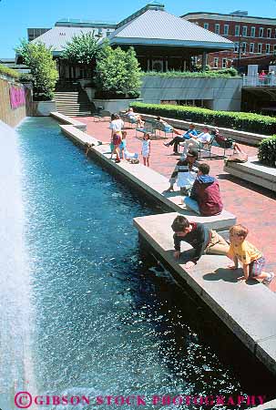 Stock Photo #11604: keywords -  african american atlanta black building buildings business center child children cities city cityscape cityscapes commercial day district downtown ethnic families family fountain fountains georgia kid kids leisure minority mix mixed mixture multi multiple outdoor outside people plaza plazas relax relaxed relaxes relaxing season south southern street streets summer sunny sunshine underground urban vacation vert warm water