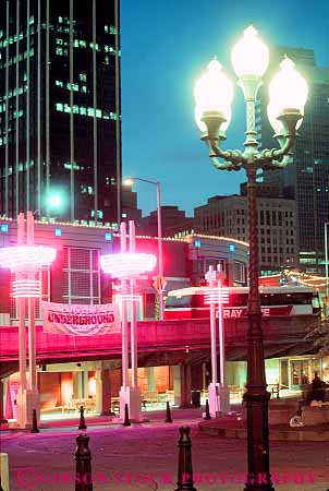 Stock Photo #11610: keywords -  atlanta bright building buildings cities city cityscape cityscapes downtown dusk georgia lighting lights neon south southern street streets underground urban vert