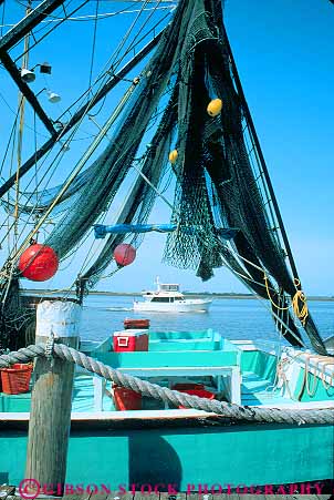 Stock Photo #14651: keywords -  boat boating boats coast coastal colorful communities community destination fishing georgia island jekyll net nets passing resort resorts shore shoreline summer travel vacation vert wharf yacht yachts