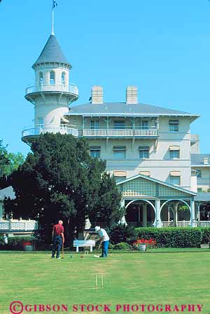 Stock Photo #14653: keywords - angle angles architecture balconies balcony building buildings circle circles circular club coast coastal communities community corner corners croquet cylinder cylindrical design destination game games georgia grass historic house island jekyll landmark landmarks lawn outdoor outside people play player players playing plays recreation rectangle rectangles resort resorts right roof roofs round shape shapes shore shoreline slope slopes sport square squares style summer tower towers tradition traditional travel triangle triangles vacation vert
