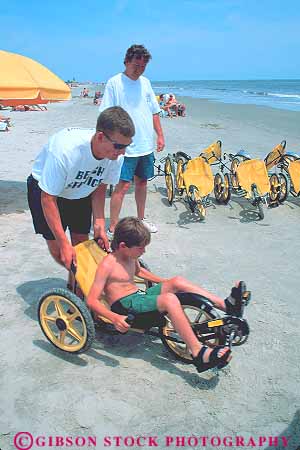Stock Photo #14658: keywords -  beach beaches bicycle boy child coast coastal communities community destination father georgia island parent peddle peddles peddling rental resort resorts ride rider riders rides riding saint sand shore shoreline simons st st. summer travel tricycle tricycles tries vacation vert
