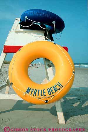 Stock Photo #14675: keywords -  atlantic beach beaches carolina circle circles circular coast coastal destination donut float floats grand hot inflatable inflated inner leisure lifeguard material myrtle ocean plastic recreation resort resorts ring rings round sand sea shape shore shoreline south stand strand sunny sunshine surf synthetic travel tube vacation vert warm water wave waves yellow