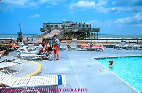 Stock Photo #14678: keywords -  atlantic beach beaches carolina child children coast coastal deck destination grand horz hot leisure myrtle ocean people play playing pool pools recreation relax relaxing resort resorts sand sea shore shoreline south strand sunbath sunbathing sunny sunshine surf swim swimming travel vacation warm water wave waves