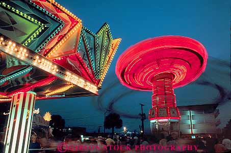 Stock Photo #14679: keywords - action amusement axis beach blur blurred bright carolina coast coastal colorful dark destination dusk dynamic evening grand horz leisure lighting lights motion movement moving myrtle neon night park parks play playing recreation resort resorts ride rides rotate rotates rotating rotation shore shoreline south spin spinning spins strand summer thrill tilt tilts titling travel turn turning turns vacation