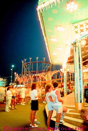 Stock Photo #14682: keywords -  amusement beach bright carolina coast coastal dark destination dusk evening grand leisure lighting lights myrtle night park parks people play playing recreation resort resorts ride rides shore shoreline south strand summer thrill travel vacation vert