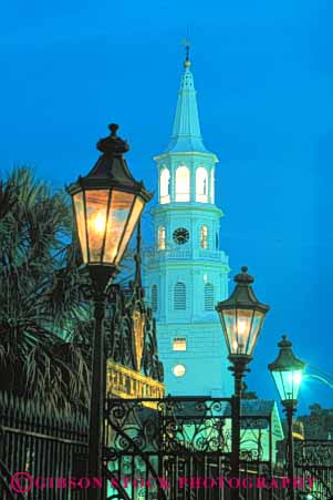 Stock Photo #9606: keywords -  architecture building buildings carolina charleston classic dark dusk evening historic lamp lamps lighting lights michaels night south st steeple street tradition traditional vert