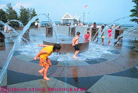 Stock Photo #9634: keywords -  african american boys carolina charleston child children destination ethnic fountain fountains fun gender girls group groups horz in minority mixed municipal park parks play playing public refresh refreshing south splash spray summer travel water waterfront youth