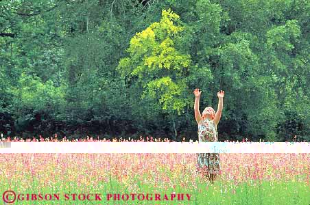 Stock Photo #14698: keywords -  alone arm arms child children fields flower girls horz kid kids landscape look looking looks natural nature one outdoor outdoors outside pink privacy private reach reached reaches skyward skywards solitary solitude up upward upwards youth