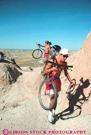 Stock Photo #14783: keywords - athlete athletic badlands bicyclist bicyclists bike bikers bikes carry crosscountry dakota eroded erodes eroding erosion formations man men mountain national park parks prairie public recreation sedimentary south sport strong vert young