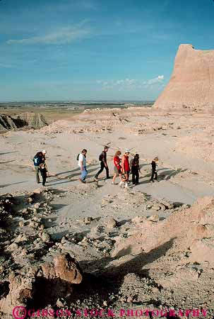Stock Photo #14784: keywords -  badlands dakota eroded erodes eroding erosion formations group groups hike hiker hikers hiking national park parks prairie public recreation sedimentary south vert walk walker walking walks