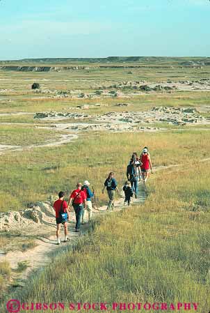 Stock Photo #14786: keywords -  badlands dakota eroded erodes eroding erosion formations group groups hike hiker hikers hiking national park parks prairie public recreation sedimentary south vert walk walker walking walks
