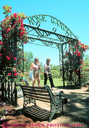 Stock Photo #12182: keywords -  arch arches boise botanical chat chatting friend friends friendship garden gardens gate gates idaho iron metal pair rise talk talking through vert walk walkers walking walks woman women wrought