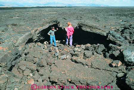 Stock Photo #14807: keywords - adventure cave caves child children craters deposit earth eruption exploration explore explores exploring flow flowed flows formation formations geologic geological geology hike hiking horz idaho kid kids lava monument moon national nature of open opening outdoor outside pair park parks public rock science tube tubes two volcanic volcano walk walking