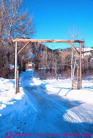 Stock Photo #14818: keywords -  arch arches cold countryside driveway entrance entries entry frame frames freeze freezing frozen gate gates grade idaho ketchum landscape low mountain mountains plow plowed ranch ranches region remote road roads rocky rural scenery scenic season snow state sun valley vert white winter wood wooden