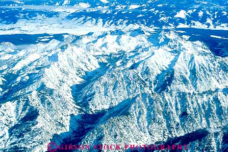 Stock Photo #14820: keywords - aerial aerials cold desolate desolation freeze freezing frozen horz idaho landscape mountain mountains nature peak peaks range ranges region rocky rugged scenery scenic season slope slopes snow state sunset terrain wilderness winter