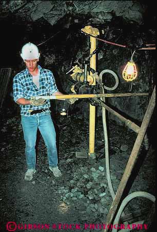 Stock Photo #14829: keywords - career cave cavern caverns caves demo demonstrate demonstrates demonstrating equipment geologic geological geology hardhat historic history idaho job jobs machine machinery man men metal mine miner miners mining occupation precious rock shaft shafts sierra silver tool tools underground vert wallace work worker workers working works