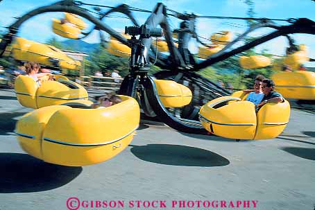 Stock Photo #14838: keywords -  action alene amusement blur blurred coeur community couple couples d dynamic fun horz laugh laughing laughs leisure motion move movement moves moving park, parks play playing recreation resort ride rider riders rides riding silverwood smile smiles smiling spin spinning spins summer theme thrill vacation yellow