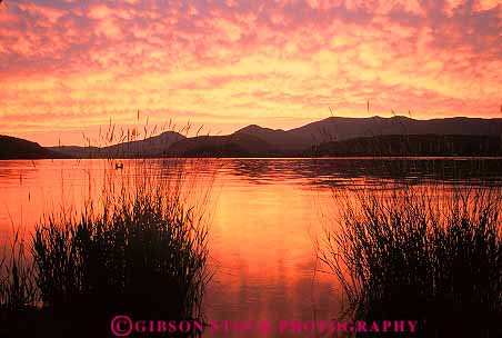Stock Photo #14855: keywords -  bright cloud clouds color colorful communities community destination dusk evening horz idaho lake lakes landscape marsh marshland marshlands mountain mountains orange oreille pend red reflect reflecting reflection reflects region resort resorts rocky sandpoint scenery scenic summer sunset sunsets vacation warm water wetland wetlands