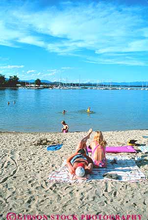 Stock Photo #14858: keywords -  beach beaches child children communities community couple couples destination families family idaho lake lakes mountain mountains orielle parent parents pend people person region relax relaxes relaxing resort resorts rocky sandpoint summer swim swimming vacation vert water