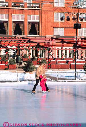 Stock Photo #14887: keywords -  assist assisting assists child children communities community daughter destination help helping helps hold holding ice idaho learn learning lodge mom mother mountain mountains outdoor outside parent people play playing practice recreation region resort resorts rink rinks rocky single skate skaters skates skating ski slide sliding sport sun teach teaching travel vacation valley vert winter young