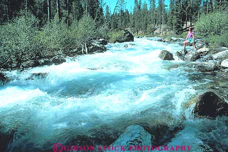 Stock Photo #14915: keywords - area cascade cascades cascading creek hike hiker hikers hikes hiking horz idaho lake landscape mountain mountains national nature rapid rapids recreation redfish region released rocky sawtooth scenery scenic stand standing stands water woman women