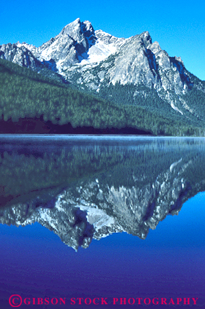 Stock Photo #14920: keywords -  area calm clean flat idaho lake lakes landscape mirror mirrors mountain mountains national nature peak peaks pristine range recreation reflect reflecting reflection reflects region rocky sawtooth scenery scenic smooth stanley vert water wild wilderness
