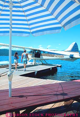 Stock Photo #14924: keywords - alene coeur communities community couple couples d dock docks flight fly flying for idaho lake lakes mountain mountains people plane planes resort resorts rocky seaplane seaplanes summer tour tourist tours traveler travelers umbrella vacation vacationing vacations vert walking water