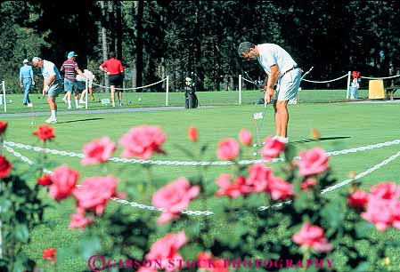 Stock Photo #14929: keywords -  alene club coeur communities community course d game games golf golfer golfers golfing horz idaho man men mountain mountains putt putting putts recreation resort resorts rocky sport summer vacation vacationing vacations