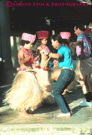 Stock Photo #14975: keywords -  audience coconut costume costumed dance dancer dancers dances dancing destination display displaying displays girl girls hawaii hawaiian hula island islands kauai landscape man men participate participates participation people perform performance performers performing plantation recreation scenery scenic show tourist tourists tradition traditional travel tropic tropical tropics vert woman women