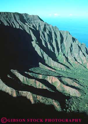 Stock Photo #8707: keywords - cliff cliffs climate coast coastal desolate desolation destination earth erode eroded eroding erosion hawaii hawaiian island islands kauai landscape marine maritime moist mountain mountains na nature ocean pali ravine ravines remote resort resorts scenery scenic science sea seashore seawater shore shoreline steep terrain travel tropical usa vacation vert water wet wilderness
