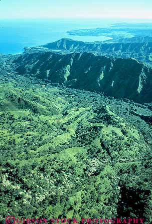 Stock Photo #15001: keywords - aerial aerials dense destination forest green hawaii hawaiian hill hills island islands kauai landscape lush mountain mountains rainforest rough rugged scenery scenic slope slopes steep terrain travel tropic tropical tropics vacation vacationing vacations verdant vert waimea