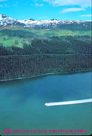 Stock Photo #10382: keywords -  aerial aerials alaska alone boat boating boats juaneu landscape motorboat motorboats mountain mountains moving one scenery scenic small solitary solitude vert wake